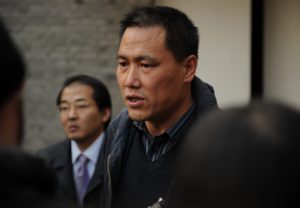Pu Zhiqiang (C), the lawyer for Chinese