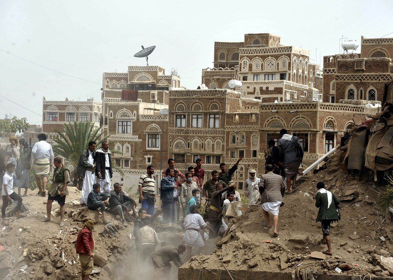 Yemenis search for the air attack victims around the destroyed buildings after Saudi-led airstrikes hit Sanaa's Old City, Yemen, on June 04, 2015.