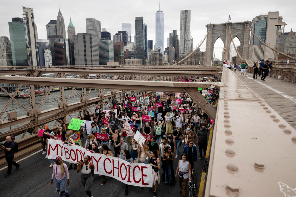 Demonstrators march on the Brooklyn Bridge during the abortion rights rally in reaction to the leak of the US Supreme Court draft abortion ruling 